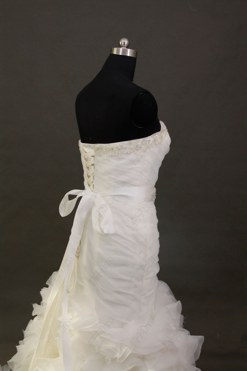 Mermaid tiered wedding dress with beaded sash