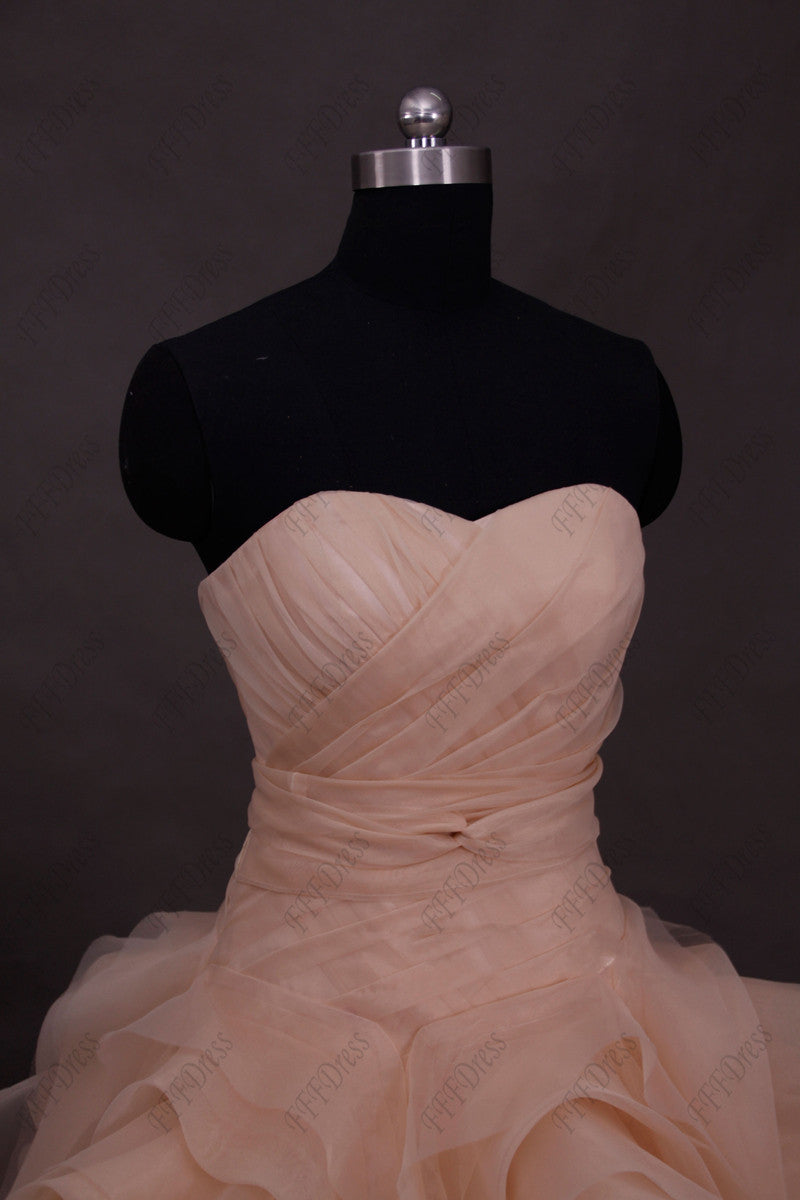 Blush ball gown wedding dress with swirls