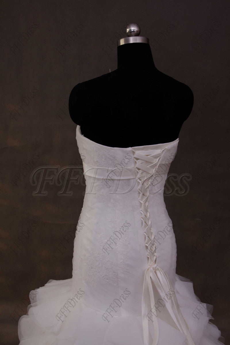 Mermaid wedding dress with tiered skirt