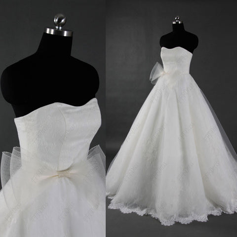 Lace sweetheart ball gown wedding dress with sash