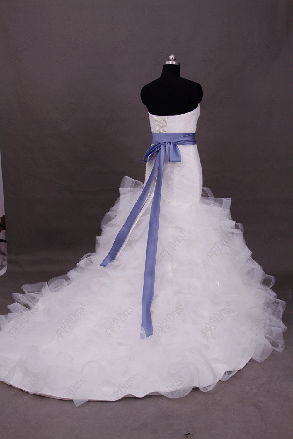 Mermaid sweetheart wedding dress with ruffled skirt and wide trim