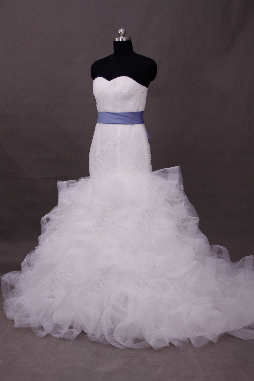 Mermaid sweetheart wedding dress with ruffled skirt and wide trim