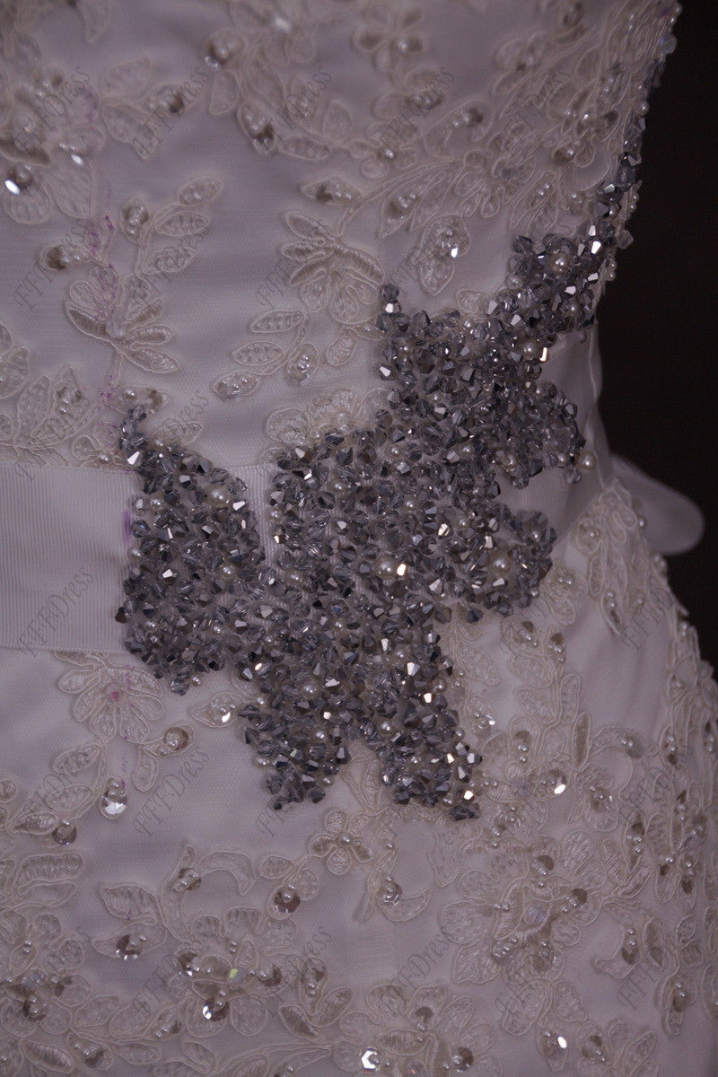 Mermaid beaded lace wedding dress with ruffled skirt