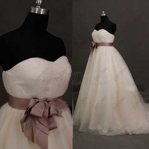 Sweetheart ball gown wedding dress with dusty rose sash